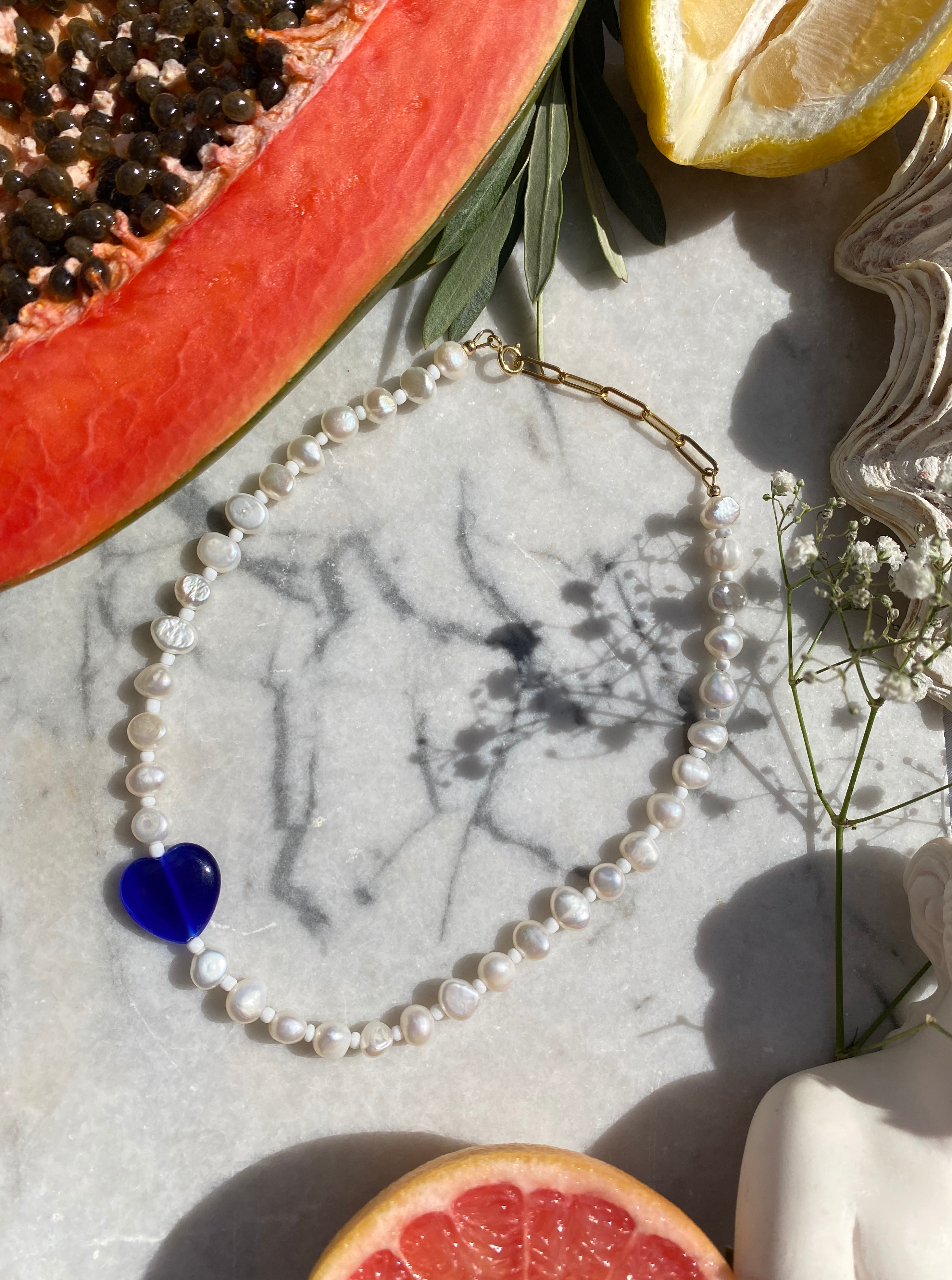 EROS Freshwater pearl necklace with blue Cats Eye glass heart