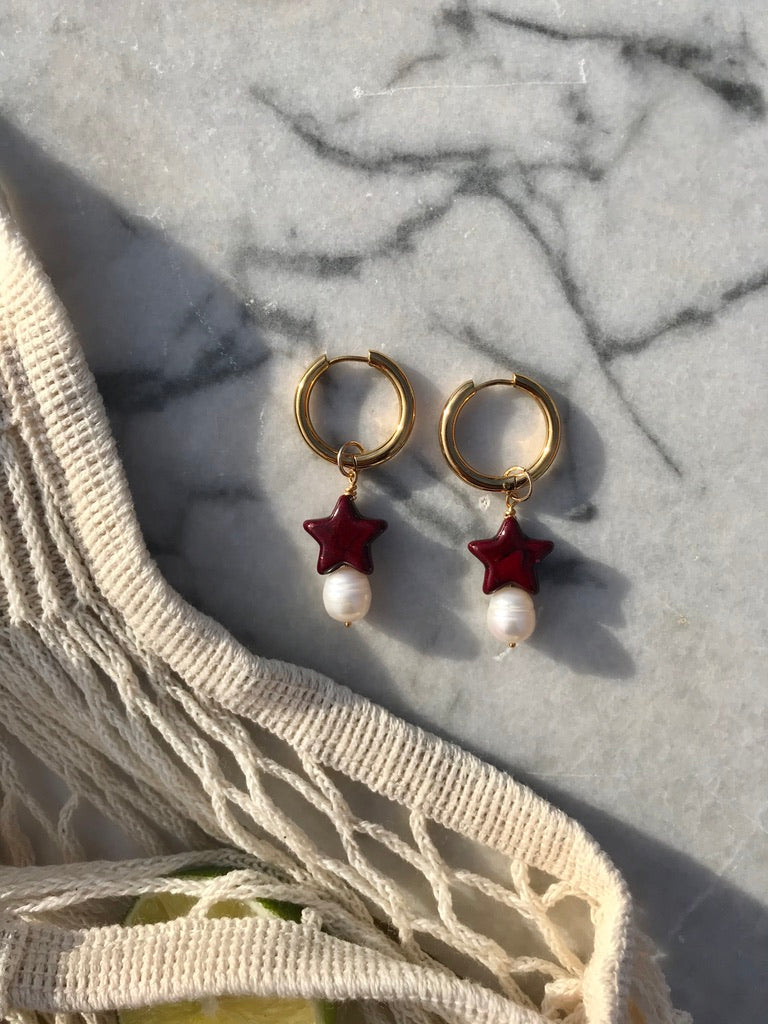 Gold plated stainless steel hoops with freshwater baroque and dark red star bead
