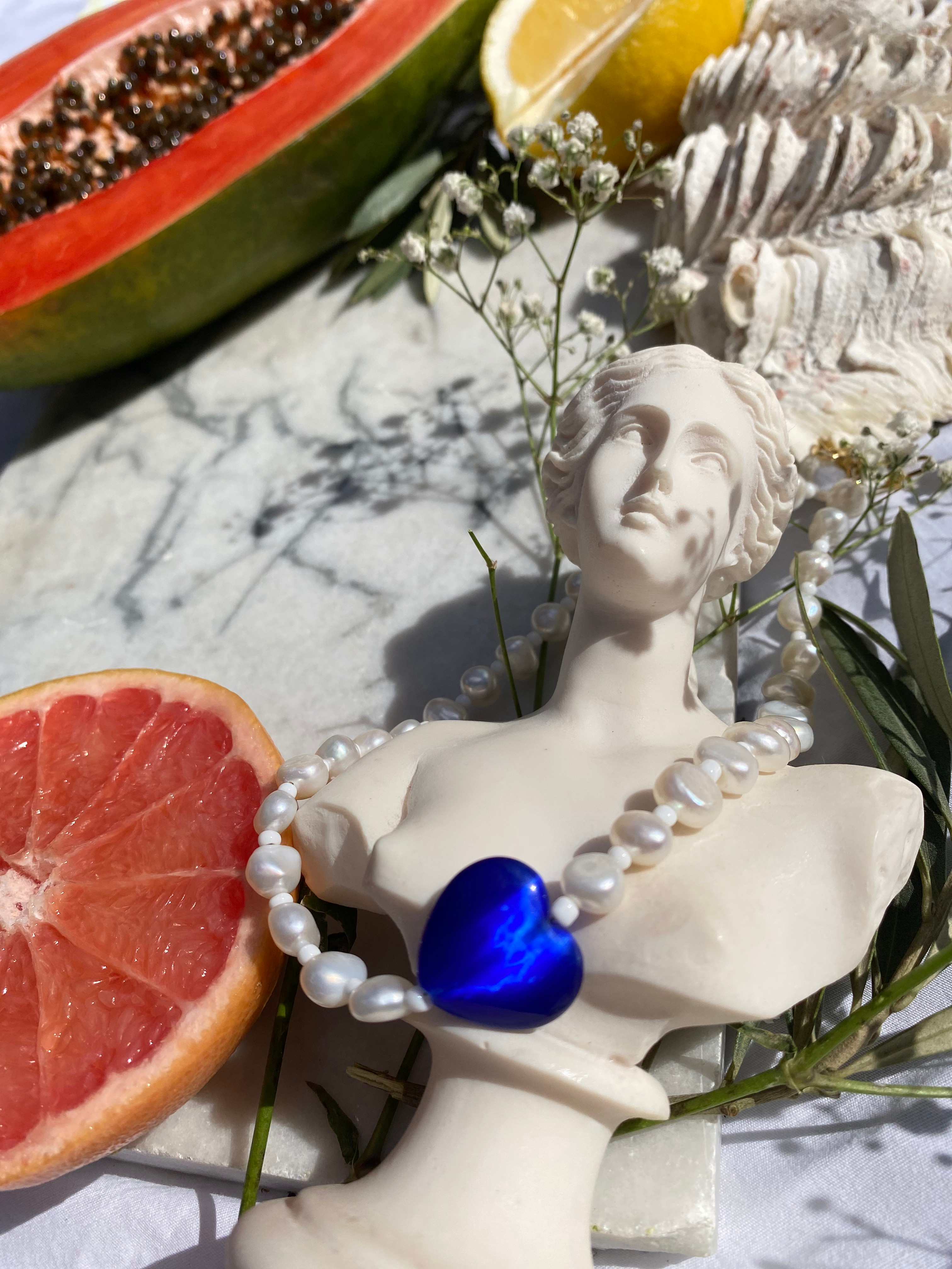 EROS Freshwater pearl necklace with blue Cats Eye glass heart